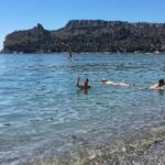 persone in mare al poetto cagliari promozione spiaggia day