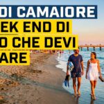 Coppia che passeggia sulla spiaggia di Lido di Camaiore con vista sul pontile