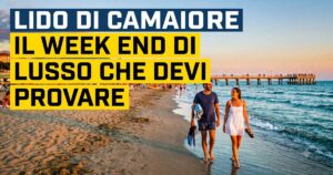 Coppia che passeggia sulla spiaggia di Lido di Camaiore con vista sul pontile