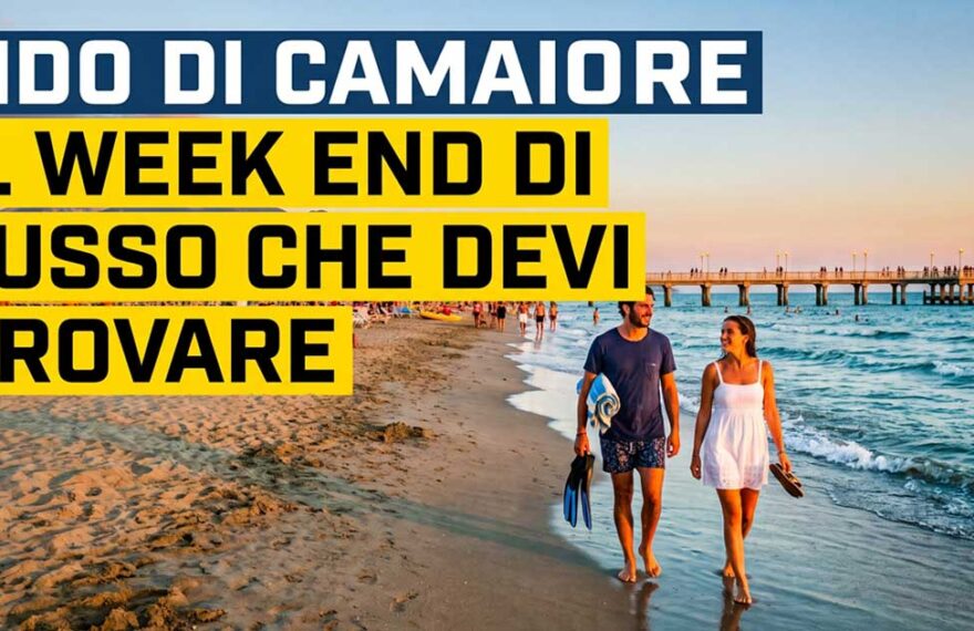 Coppia che passeggia sulla spiaggia di Lido di Camaiore con vista sul pontile