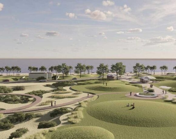 Rendering del progetto Parco del Mare a Ostia con aree verdi, dune e percorsi pedonali lungo il litorale.
