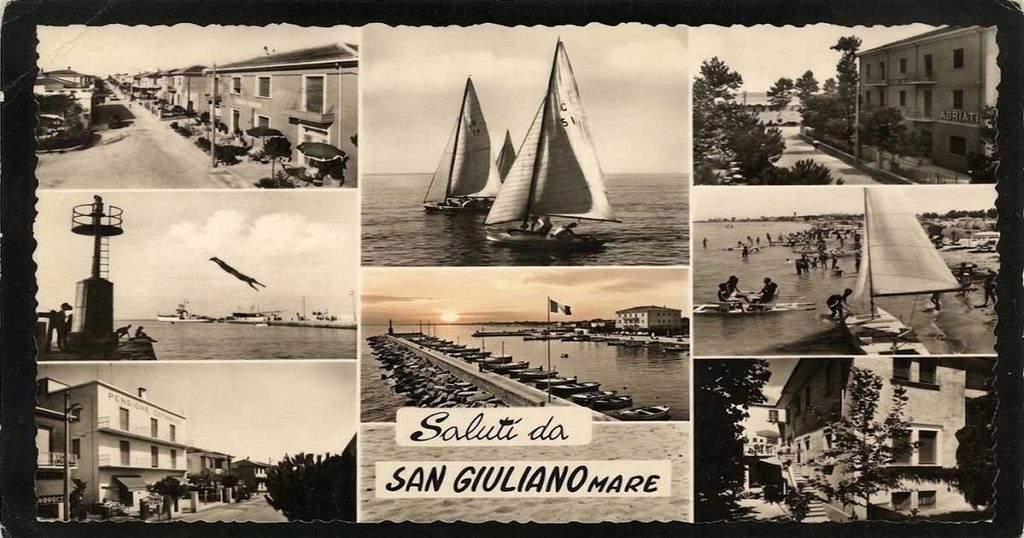 Cartolina d'epoca composita in bianco e nero con scorci di San Giuliano Mare tra barche a vela e passeggiate