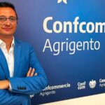 Gero Niesi presidente di Confcommercio Agrigento davanti al logo dell'associazione per la notizia sulle gare balneari